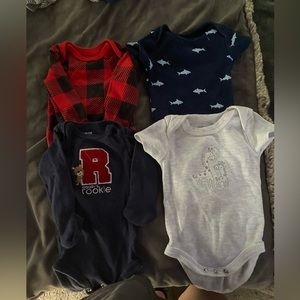 Tons of baby clothes, hats, mits, pants, and swaddles!